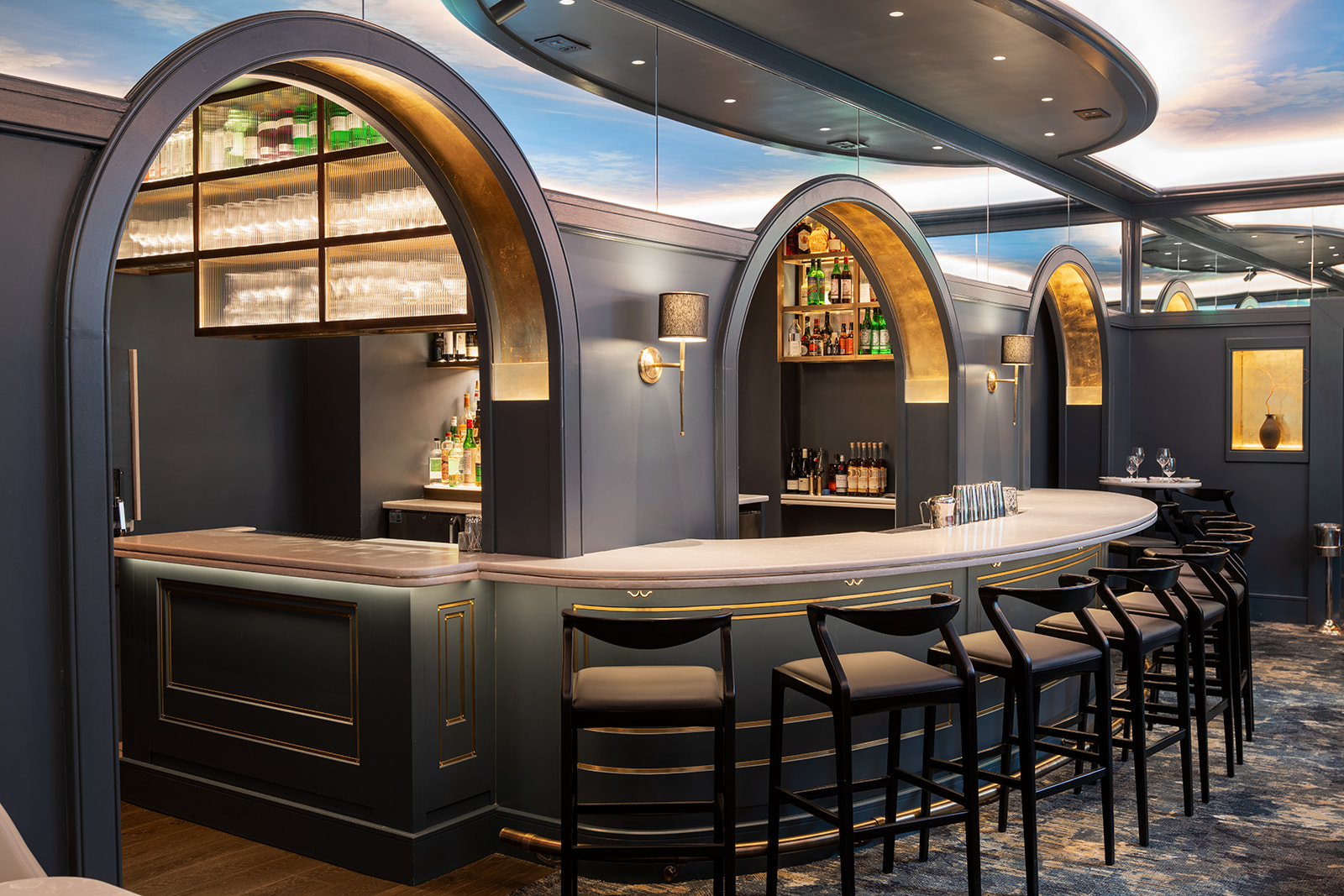 Curved bar beneath gilded arches at Union League Cafe