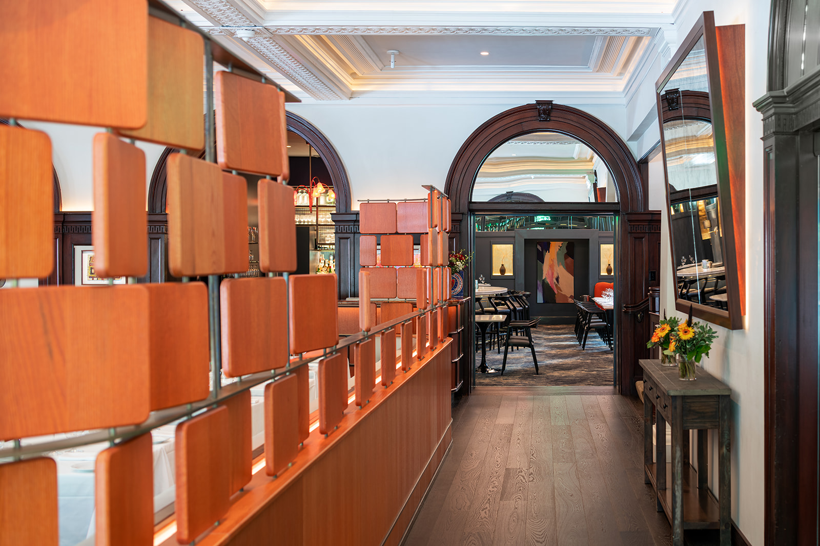 Copper tile screen framing an arched doorway at Union League Cafe